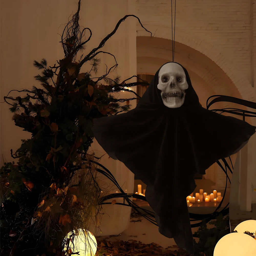 Small black skull ghost hanging beside a tree
