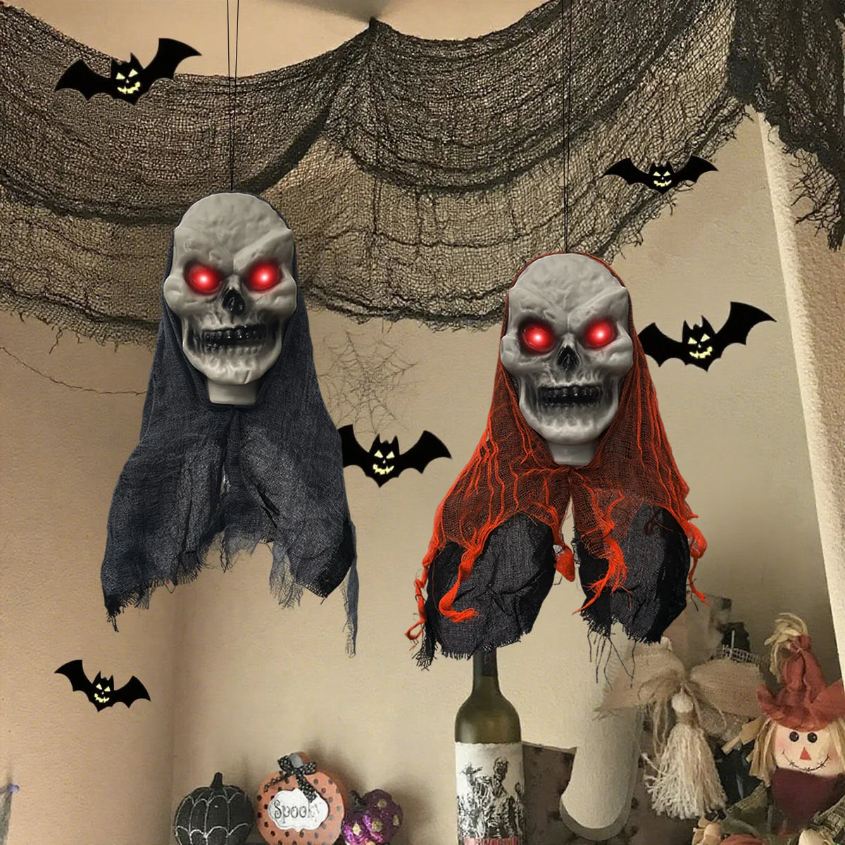 Black and orange hanging skull ghosts in a Halloween room