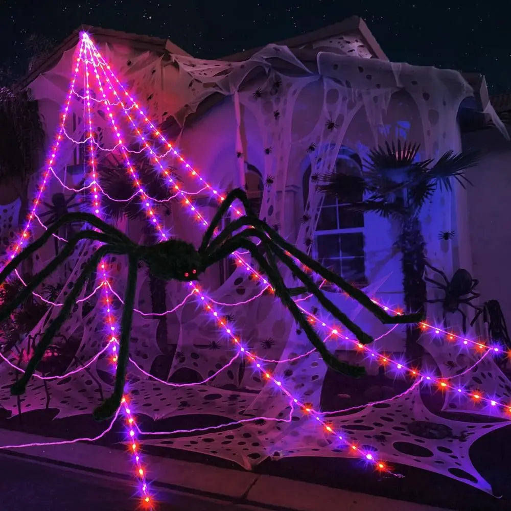 Purple and orange triangular spider web lights staged with a separate spider